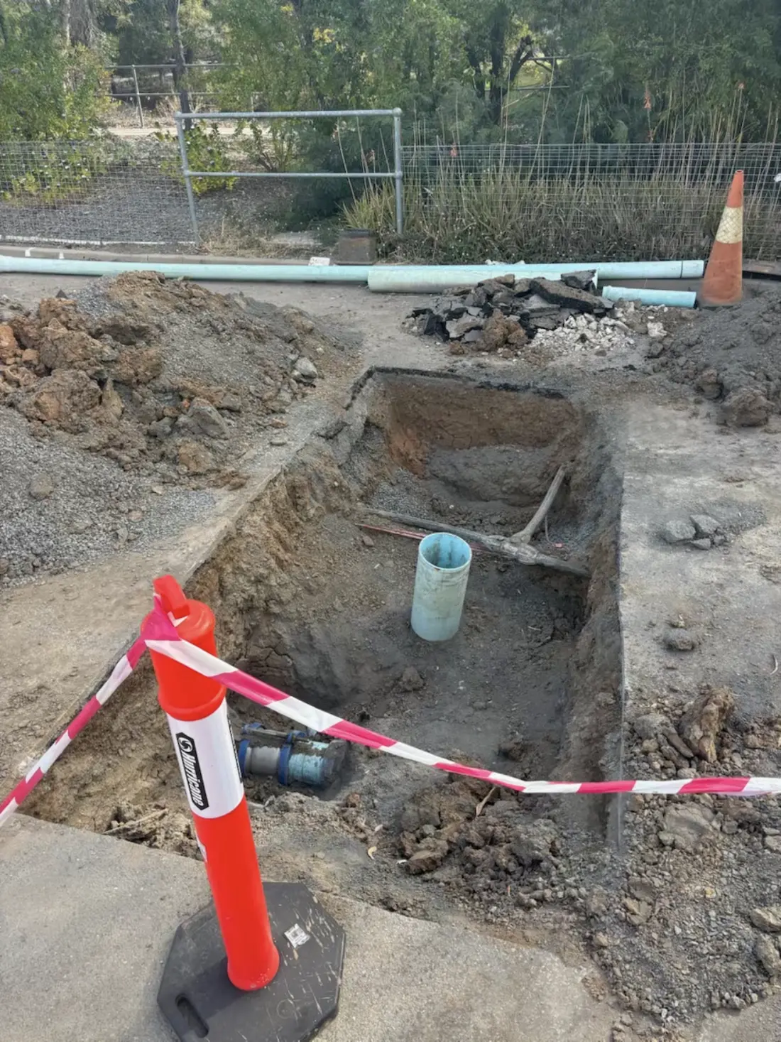 Exposed water service in a hydro excavated pit