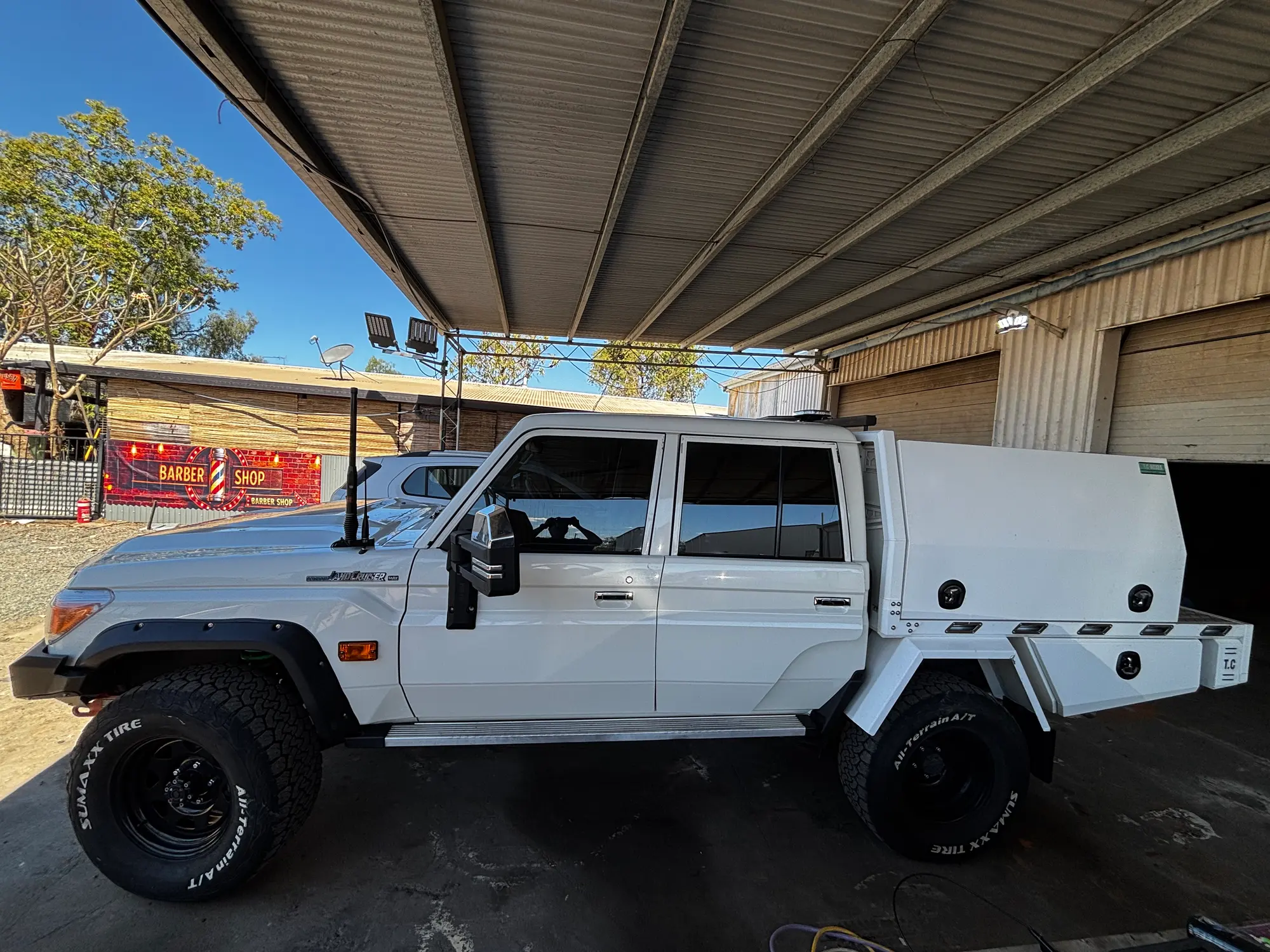White Toyota LandCruiser 79 work ute